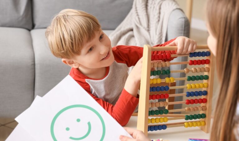 Little Boy with level 2 autism Playing with Abacus at Psychologist's Office.